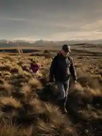 Dan Case hiking through open Patagonia landscape