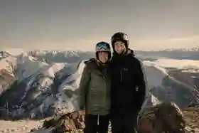 Dan Case skiing in the mountains with his wife